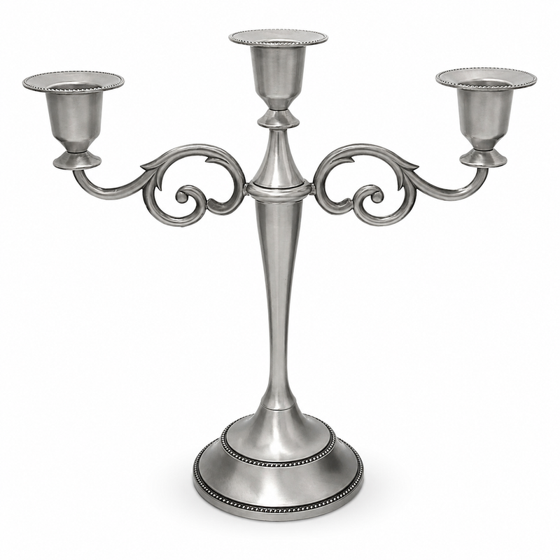 Gold three-arm metal candelabra candle holder on a white background