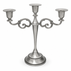 Gold three-arm metal candelabra candle holder on a white background