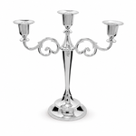 Gold three-arm metal candelabra candle holder on a white background