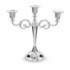 Gold three-arm metal candelabra candle holder on a white background