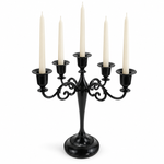 Gold three-arm metal candelabra candle holder on a white background