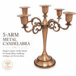 Gold three-arm metal candelabra candle holder on a white background
