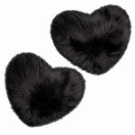 Rose red double attached heart shaped faux fur rug on a white background