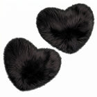 Rose red double attached heart shaped faux fur rug on a white background