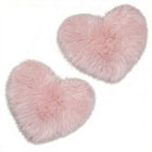 Rose red double attached heart shaped faux fur rug on a white background