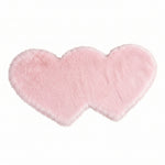 Rose red double attached heart shaped faux fur rug on a white background