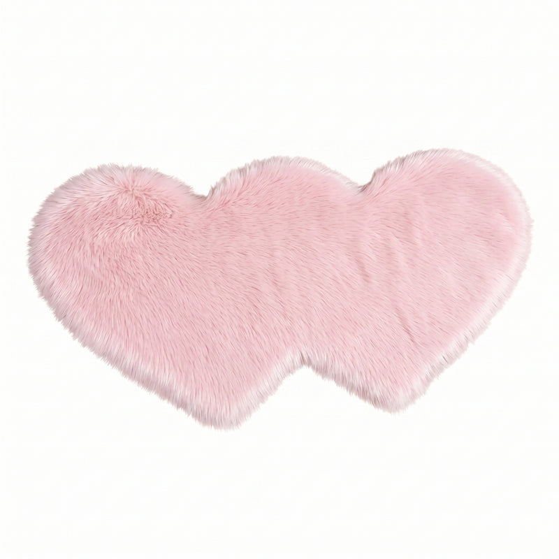 Rose red double attached heart shaped faux fur rug on a white background