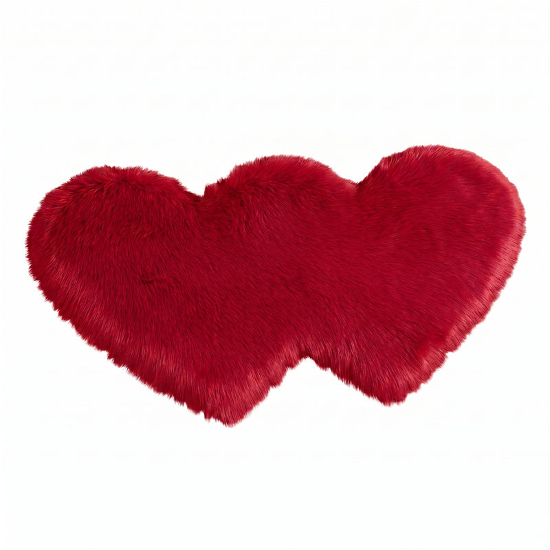 Rose red double attached heart shaped faux fur rug on a white background
