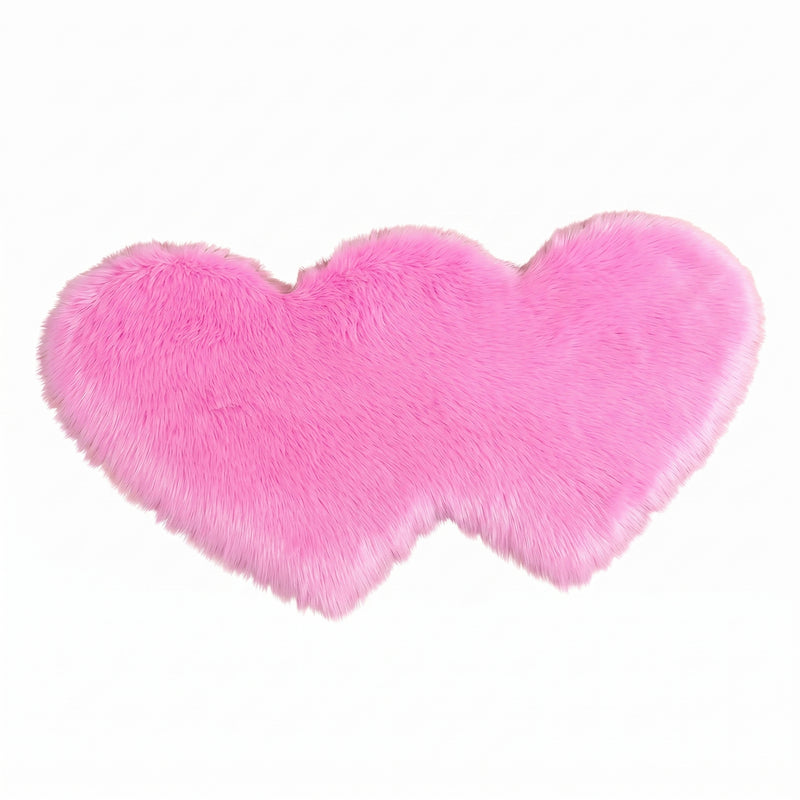 Rose red double attached heart shaped faux fur rug on a white background