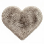 Rose red double attached heart shaped faux fur rug on a white background