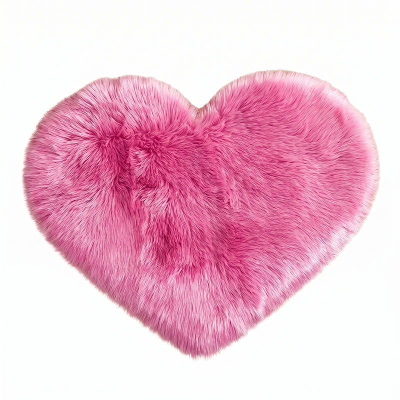Rose red double attached heart shaped faux fur rug on a white background