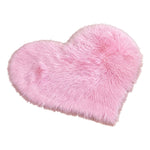 Rose red double attached heart shaped faux fur rug on a white background