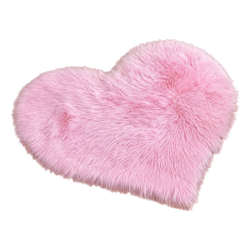 Rose red double attached heart shaped faux fur rug on a white background