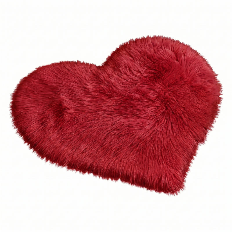 Rose red double attached heart shaped faux fur rug on a white background