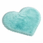 Rose red double attached heart shaped faux fur rug on a white background