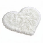 Rose red double attached heart shaped faux fur rug on a white background