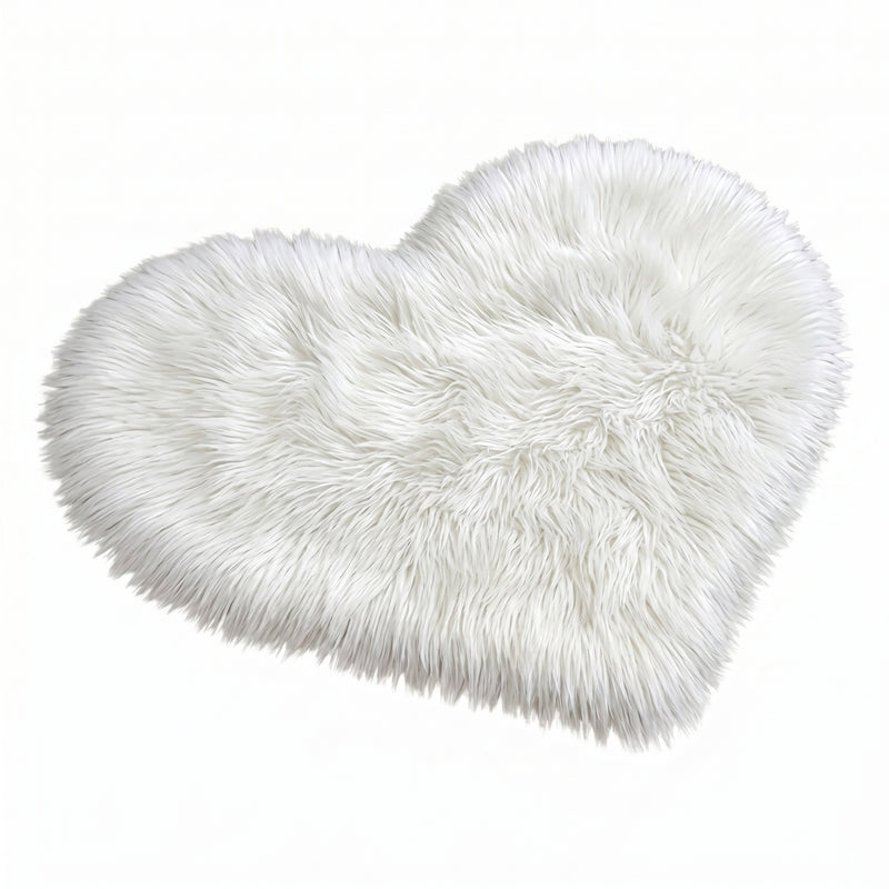Rose red double attached heart shaped faux fur rug on a white background
