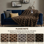 Woman in bed holding the heated blanket's controller next to a color-variance disclaimer and fabric swatch samples