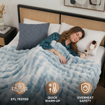Woman sleeping in bed wrapped in the white heated throw with ETL tested, quick warm-up, and overheat safety icons