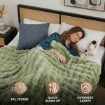 Woman sleeping in bed wrapped in the white heated throw with ETL tested, quick warm-up, and overheat safety icons