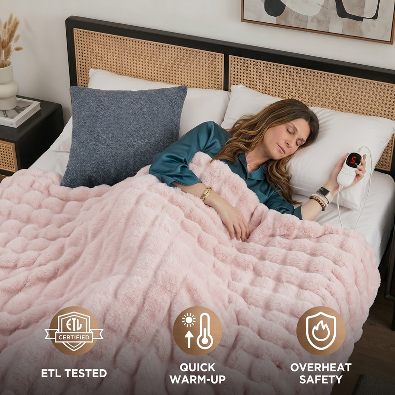 Woman sleeping in bed wrapped in the white heated throw with ETL tested, quick warm-up, and overheat safety icons