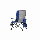 Black oversized folding camping chair with orange trim shown with two rolled carry bags on a white background