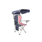 Black oversized folding camping chair with orange trim shown with two rolled carry bags on a white background