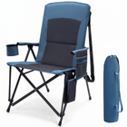 Black oversized folding camping chair with orange trim shown with two rolled carry bags on a white background