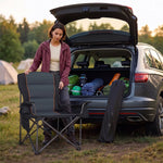Woman reading in a camping chair at a campsite with anti-slip feet, heavy-duty Q195 steel frame and reinforced joints
