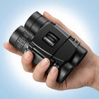 High-powered binoculars with night vision, black, shown with carrying case and lens caps