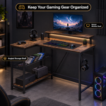 Dimension diagram of an L-shaped gaming desk showing overall size and desktop height