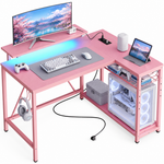 L-shaped gaming desk with LED lighting - multiple monitors and a PC setup