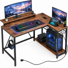 L-shaped gaming desk with LED lighting - multiple monitors and a PC setup