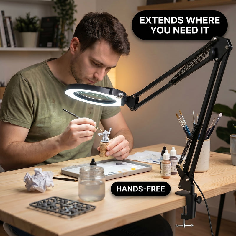 Man using a clamp-mounted LED magnifying lamp to hand-paint a miniature figure at a hobby desk