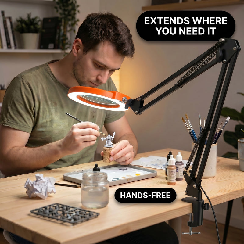 Man using a clamp-mounted LED magnifying lamp to hand-paint a miniature figure at a hobby desk