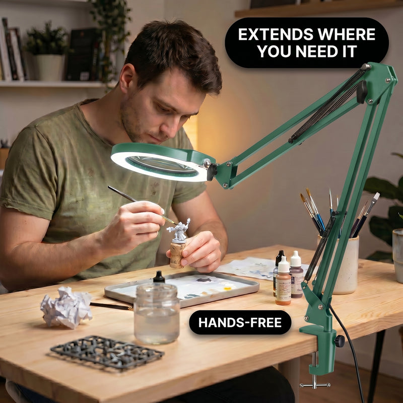 Man using a clamp-mounted LED magnifying lamp to hand-paint a miniature figure at a hobby desk