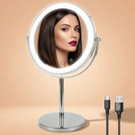 Rechargeable LED makeup mirror in chrome with lit ring light and touch control, front view