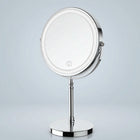 Rechargeable LED makeup mirror in chrome with lit ring light and touch control, front view