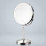 Rechargeable LED makeup mirror in chrome with lit ring light and touch control, front view
