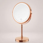 Rechargeable LED makeup mirror in chrome with lit ring light and touch control, front view