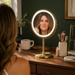 Woman applying makeup at a vanity table using the rechargeable LED makeup mirror