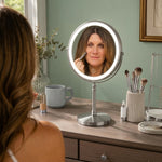 Woman applying makeup at a vanity table using the rechargeable LED makeup mirror