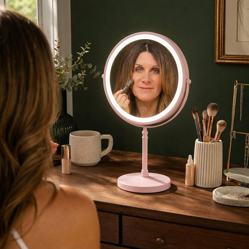 Woman applying makeup at a vanity table using the rechargeable LED makeup mirror
