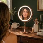 Woman applying makeup at a vanity table using the rechargeable LED makeup mirror