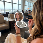 Comparison graphic showing the LED travel makeup mirror's auto-sensor lighting versus a manual-switch mirror