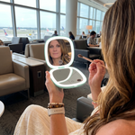 Comparison graphic showing the LED travel makeup mirror's auto-sensor lighting versus a manual-switch mirror