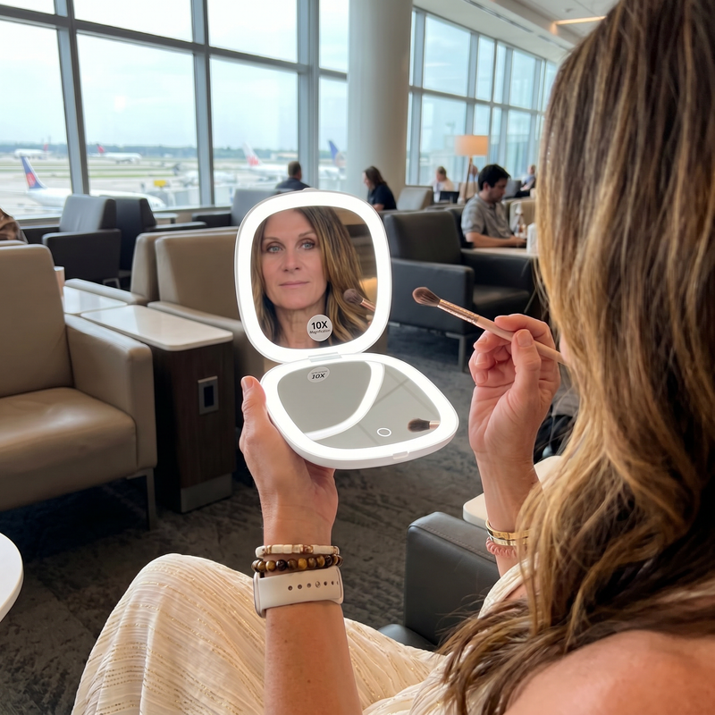 Comparison graphic showing the LED travel makeup mirror's auto-sensor lighting versus a manual-switch mirror
