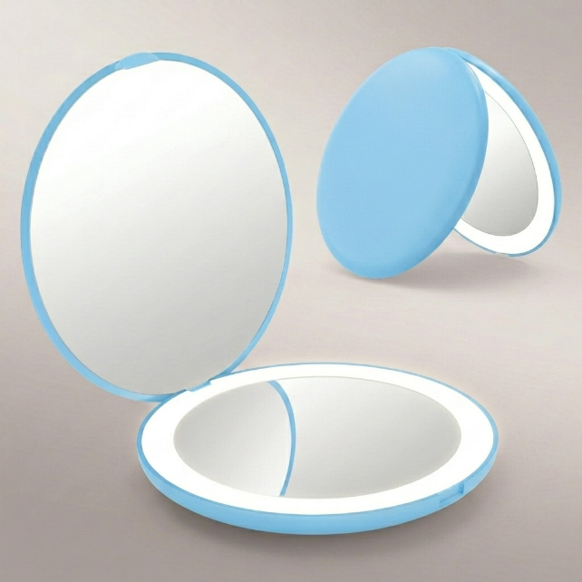 LED travel makeup mirror in pink, shown closed and open with LED lights on