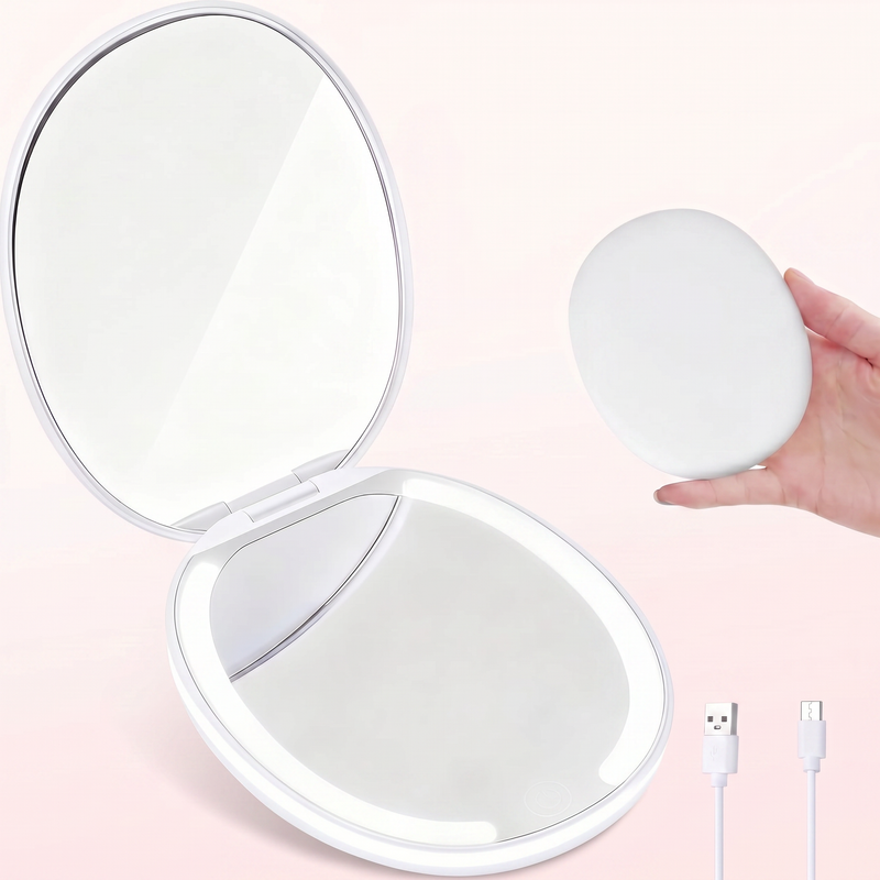 LED travel makeup mirror in pink, shown closed and open with LED lights on