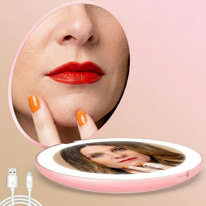 LED travel makeup mirror in pink, shown closed and open with LED lights on